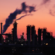 Stock photo of oil refinery at sunset